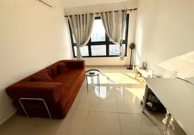 a living room with a couch and a table at M Vertica Homestay in Kuala Lumpur