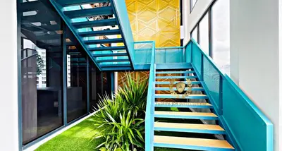 a staircase in an office building with blue steps at The Majestic Gen Luxury Suites KLCC in Kuala Lumpur