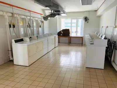 a bathroom with sinks and toilets in a room at Anhome Seri bukit Ceylon in Kuala Lumpur