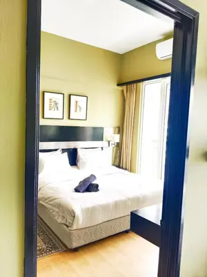 a mirror reflection of a bed in a bedroom at Anhome Seri bukit Ceylon in Kuala Lumpur