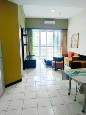 a living room with a couch and a table at Anhome Seri bukit Ceylon in Kuala Lumpur