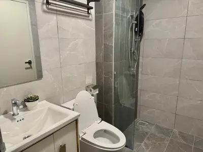 a bathroom with a toilet and a sink and a shower at Majestic Residence Suite KLCC in Kuala Lumpur