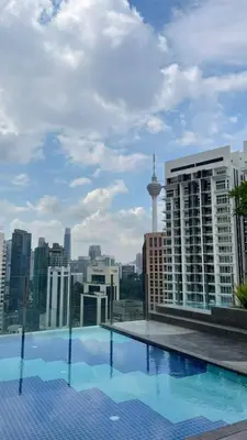 a large swimming pool on the roof of a building at Majestic Residence Suite KLCC in Kuala Lumpur