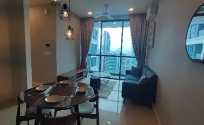 a dining room with a table and chairs and a room with a window at Bedin Hotels in Kuala Lumpur