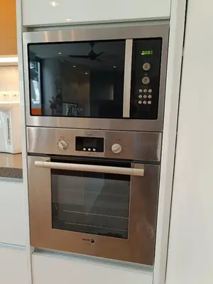 a microwave oven sitting inside of a kitchen at Penthouse-Bukit Bintang in Kuala Lumpur