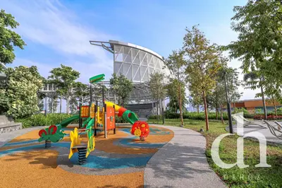 a playground in a park in front of a building at Trion KL Residence by Dehoz Suites in Kuala Lumpur