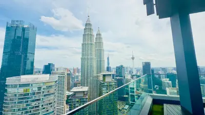 a view of a city skyline with tall buildings at Star Residence Suites KLCC Sky pools in Kuala Lumpur