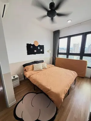 a bedroom with two beds and a ceiling fan at M Vertica KL Cheras in Kuala Lumpur