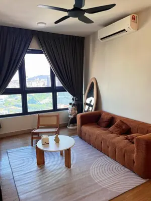 a living room with a couch and a table at M Vertica KL Cheras in Kuala Lumpur