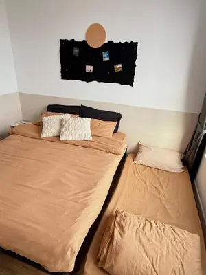 two beds sitting next to each other in a bedroom at M Vertica KL Cheras in Kuala Lumpur