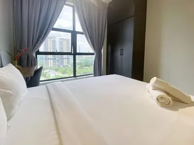 a bedroom with a large white bed with a window at Arte Mont Kiara By Comfortcorner in Kuala Lumpur
