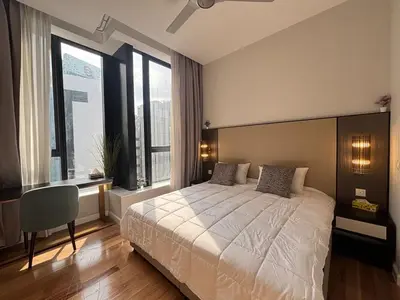 a bedroom with a large bed and large windows at Pavilion Ceylon Hill Luxury suit Bukit Bintang by cupidhome in Kuala Lumpur