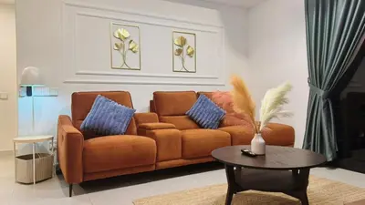 a living room with a couch and a table at The Atrium at Jalan Ampang by OKBnB- Modern Cozy 3 Bedroom Apartment 4 Mins to KLCC in Kuala Lumpur