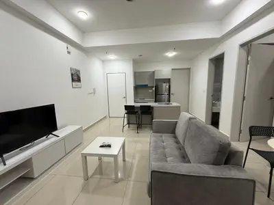 a living room with a couch and a table at Trion KL Residence By CozyNest in Kuala Lumpur