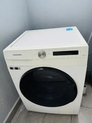 a white microwave oven sitting next to a wall at Trion KL Residence By CozyNest in Kuala Lumpur