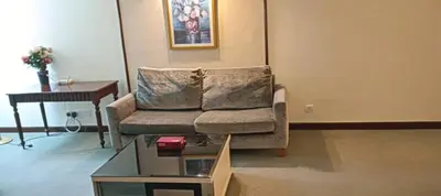 a living room with a couch and a table at Times Square apartment klcc in Kuala Lumpur