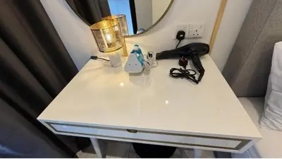 a white table with a lamp and a mirror at Bukit Bintang in Kuala Lumpur
