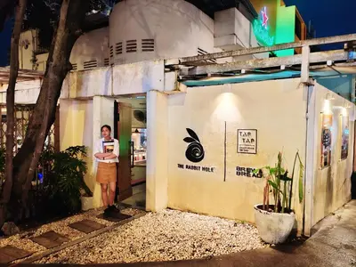 a man standing outside of a building at night at KLCC Pavilion 127 Alor Street Ceylon KL Bukit Bintang 5 Pax in Kuala Lumpur