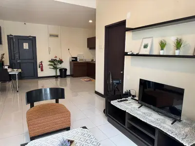 a living room with a fireplace and a chair at KLCC Pavilion 127 Alor Street Ceylon KL Bukit Bintang 5 Pax in Kuala Lumpur