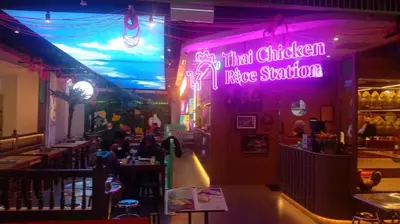 a restaurant with a purple neon sign in a restaurant at QUILL RESIDENCE by ASHNAS in Kuala Lumpur