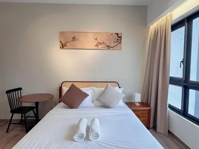 a bedroom with a bed with white shoes on it at KLCC Agile 雅居乐民宿-吉隆坡 I 双子塔 I Walking distance to MRT & TRX & Bukit Bintang I 中英马客服 Chinese English Malay in Kuala Lumpur