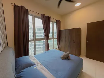 a bedroom with a teddy bear on a bed with a window at Spacious Family 2BR Balcony Comfy Regalia Suites in Kuala Lumpur