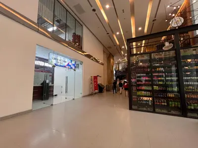 a shopping mall aisle with a store with bottles of wine at Mercu summer suits 1BR luxury couple room free Netflix 5mint WD KLCC by Top R in Kuala Lumpur