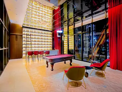 a room with a ping pong table and chairs at Scarletz Suite KLCC 2 in Kuala Lumpur