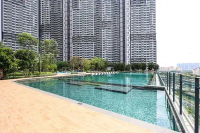 a swimming pool in a city with tall buildings at Stylish M Vertica 3 Bedroom Walk to MRT Velocity Mall in Kuala Lumpur