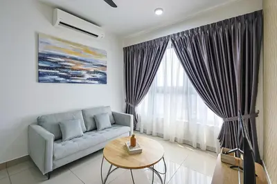 a living room with a couch and a table at Stylish M Vertica 3 Bedroom Walk to MRT Velocity Mall in Kuala Lumpur