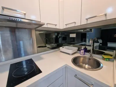 a kitchen counter with a sink and a sink at Studio in Kuala Lumpur