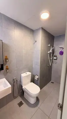 a bathroom with a toilet and a shower and a sink at M Vertica KL Cheras Velocity KLCC View in Kuala Lumpur