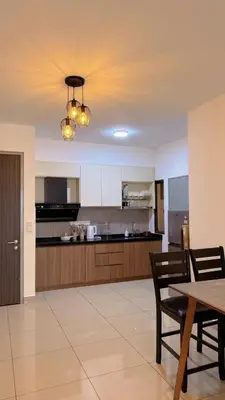 a large kitchen with a table and chairs and a ceiling at M Vertica KL Cheras Velocity KLCC View in Kuala Lumpur