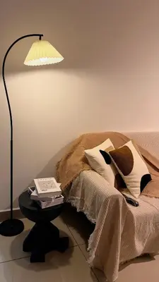 a bedroom with a bed with a lamp and a table at M Vertica KL Cheras Velocity KLCC View in Kuala Lumpur