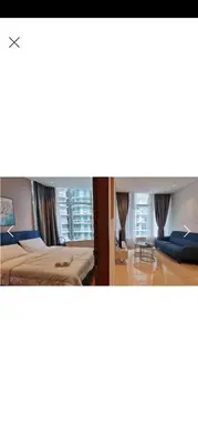 a hotel room with two beds and a window at Sky Suite By SmartWill Properties in Kuala Lumpur