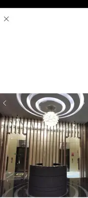 a room with a ceiling with a chandelier at Sky Suite By SmartWill Properties in Kuala Lumpur