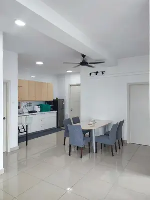 a kitchen and dining room with a table and chairs at Comfy Room in High Floor! in Kuala Lumpur
