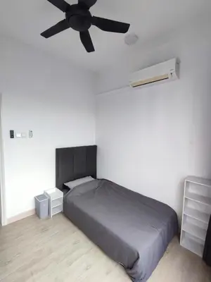 a bedroom with a bed and a ceiling fan at Comfy Room in High Floor! in Kuala Lumpur