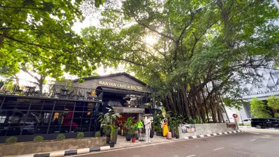 a building on the side of a street with trees at Scarletz Suite KLCC By Light House 4 in Kuala Lumpur