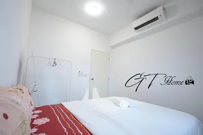 a bedroom with a bed with a sign on the wall at Gt home-Kuala Lumpur View 3Bedroom 2Bathroom in Kuala Lumpur