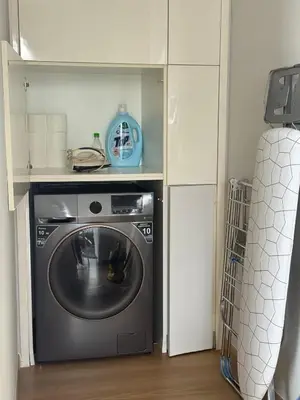 a kitchen with a washing machine in a room at Arcoris SOHO Mont Kiara 2B2B, Home Stay in Kuala Lumpur