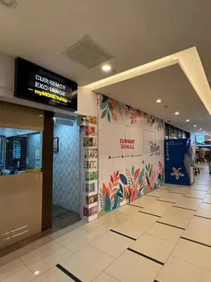 a lobby of an airport with a sign on the wall at Arcoris SOHO Mont Kiara 2B2B, Home Stay in Kuala Lumpur