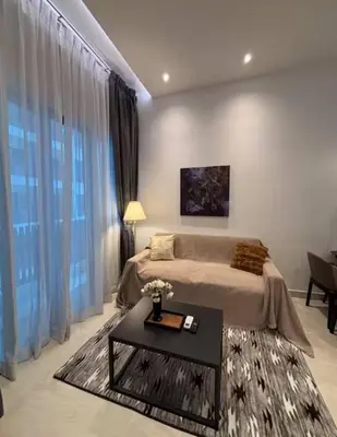 a bedroom with a bed and a table in a room at The Colony By Infinitum L in Kuala Lumpur