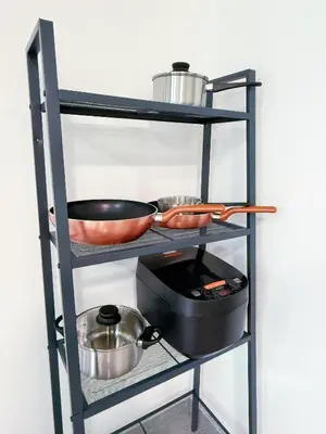 a shelf with some pots and pans on it at Agile Delima Bukit Bintang in Kuala Lumpur