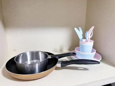 a frying pan and two cups on a counter at Agile Delima Bukit Bintang in Kuala Lumpur