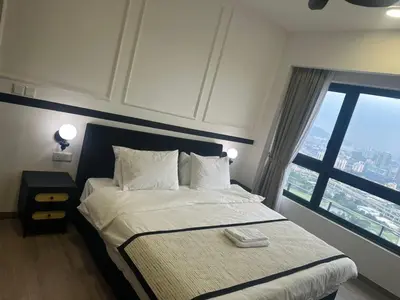 a bedroom with a bed with a large window at Agile Residence Near TRX in Kuala Lumpur