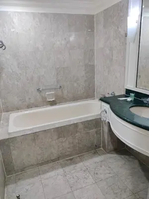 a bathroom with a bath tub and a sink at Homestay suite at times square KL in Kuala Lumpur