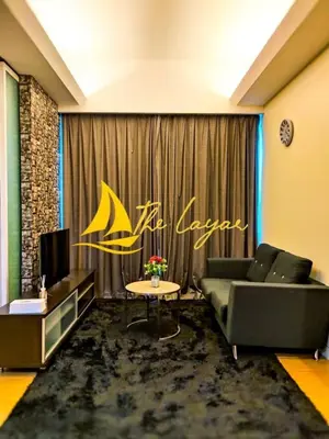 a living room with a couch and a table at Central 1BR Merdeka 118 View in Kuala Lumpur