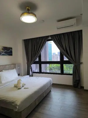 a bedroom with a large bed and a large window at Bukit Bintang Agile Residence TRX in Kuala Lumpur