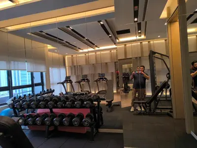 a man taking a picture of a gym at Bukit Bintang Agile Residence TRX in Kuala Lumpur
